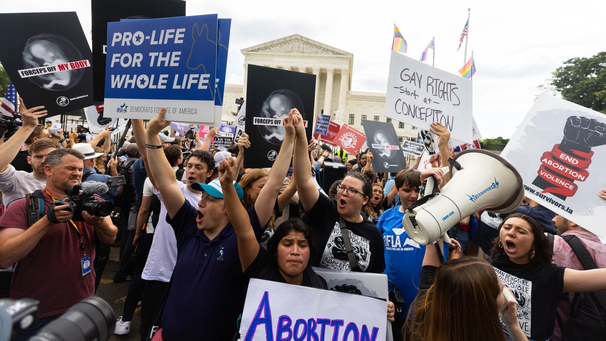 Crowds outside the court reacting to the Dobbs ruling.eme Court abortion protesters are seen after Roe v. Wade was overturned