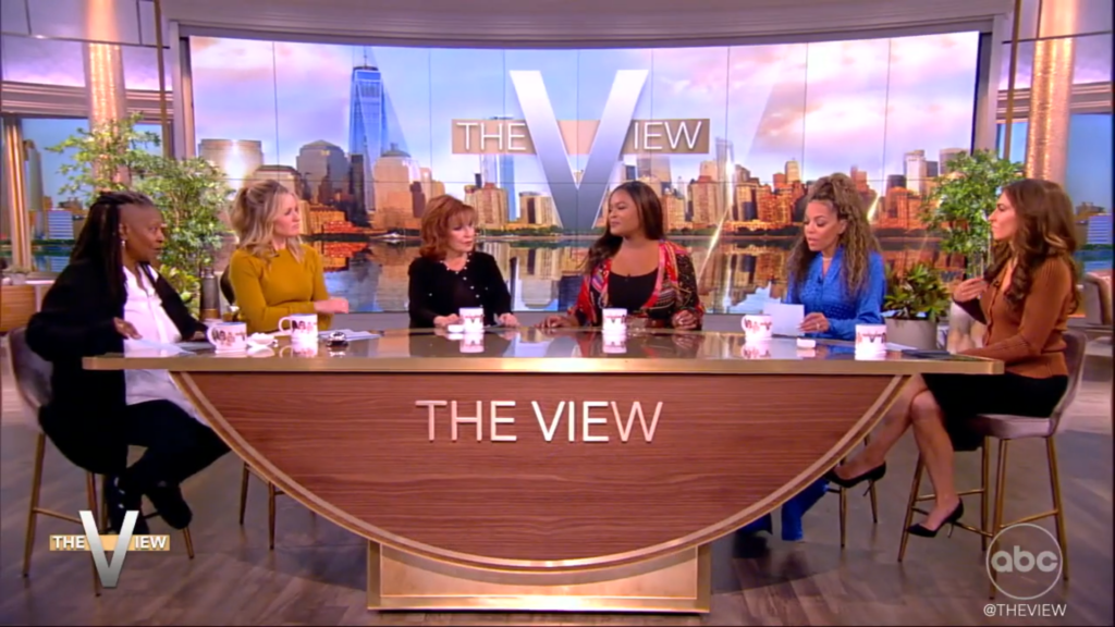 The March 2024 panel of The View sits at the table along with their guest, Alex Finnie.