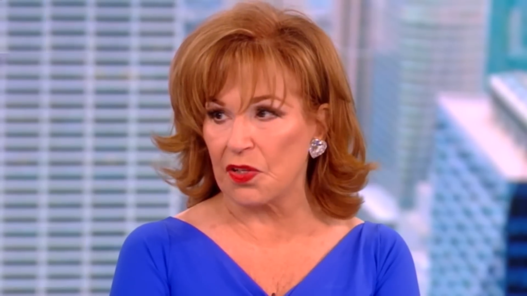 Joy Behar speaks seriously while wearing cobalt blue on The View.