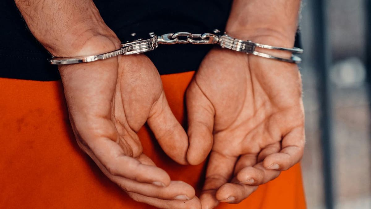 handcuffs on prisoner