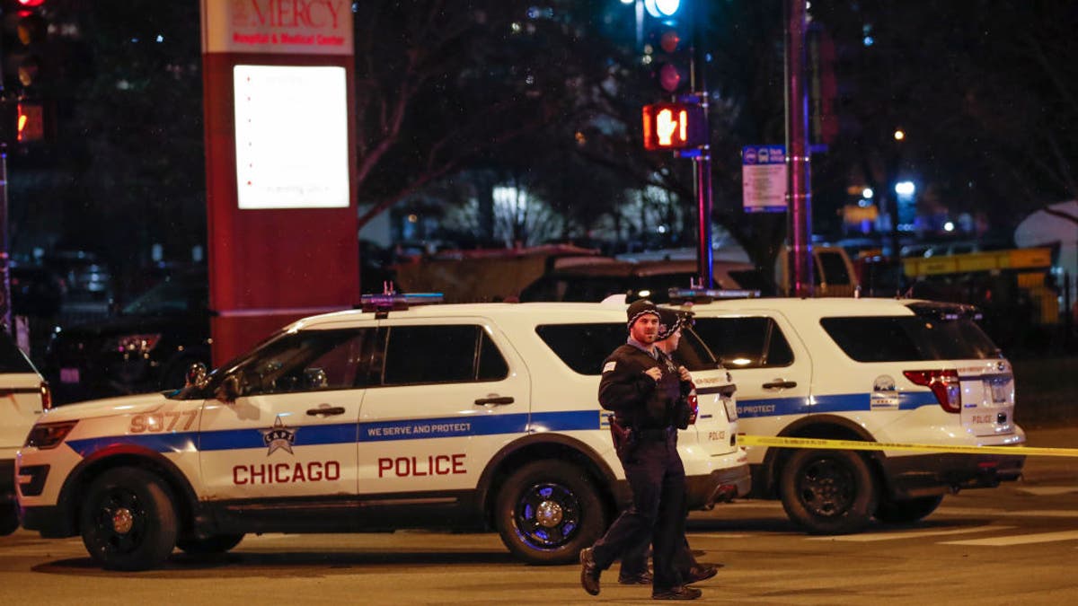 Chicago Police officers monitor the area outside of the Chicago Mercy Hospital where a gunman opened fire in Chicago on November 19, 2018. 