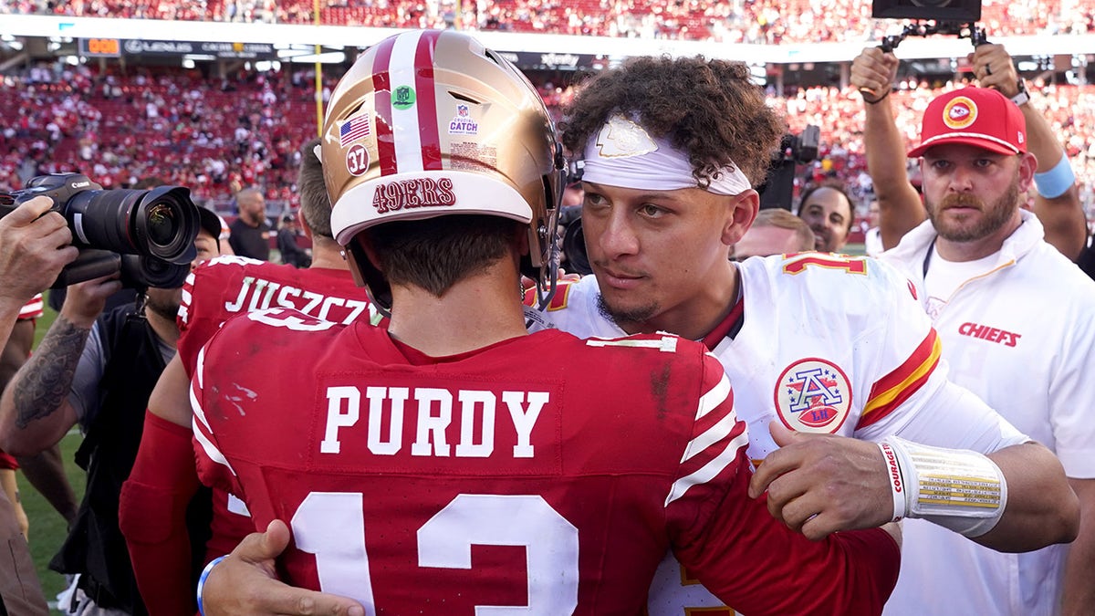 Patrick Mahomes and Brock Purdy embrace