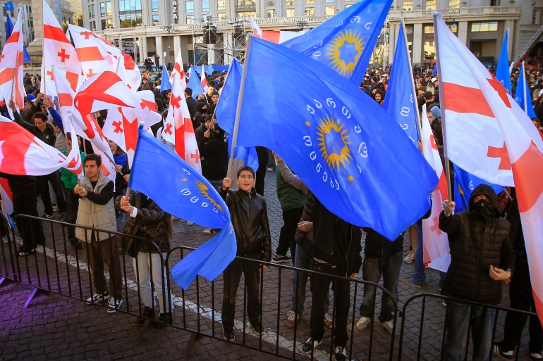 Supporters of the ruling Georgian Dream party attend a rally in the center of Tbilisi, Georgia, Wednesday, Oct. 23, 2024. [AP Photo/Shakh Aivazov]