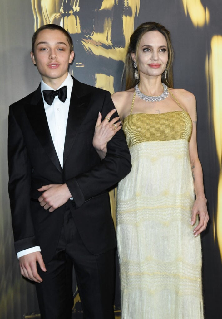 Knox and Angelina Jolie walk the red carpet together on November 17, 2024.