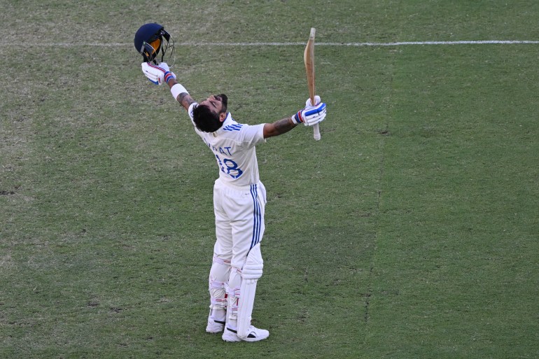 Cricket - First Test - Australia v India - Optus Stadium, Perth, Australia - November 24, 2024 India's Virat Kohli celebrates after reaching his century Dean Lewins/AAP Image via REUTERS ATTENTION EDITORS - THIS IMAGE WAS PROVIDED BY A THIRD PARTY. NO RESALES. NO ARCHIVES. AUSTRALIA OUT. NEW ZEALAND OUT