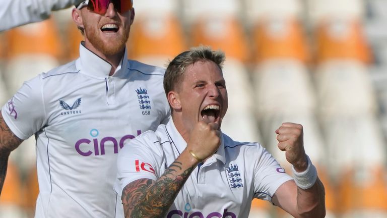 England's Brydon Carse, front, celebrates with teammates after taking the wicket of Pakistan's Saud Shakeel during the first day of the second test cricket match between Pakistan and England, in Multan, Pakistan, Tuesday, Oct. 15, 2024. (AP Photo/K.M. Chaudary)