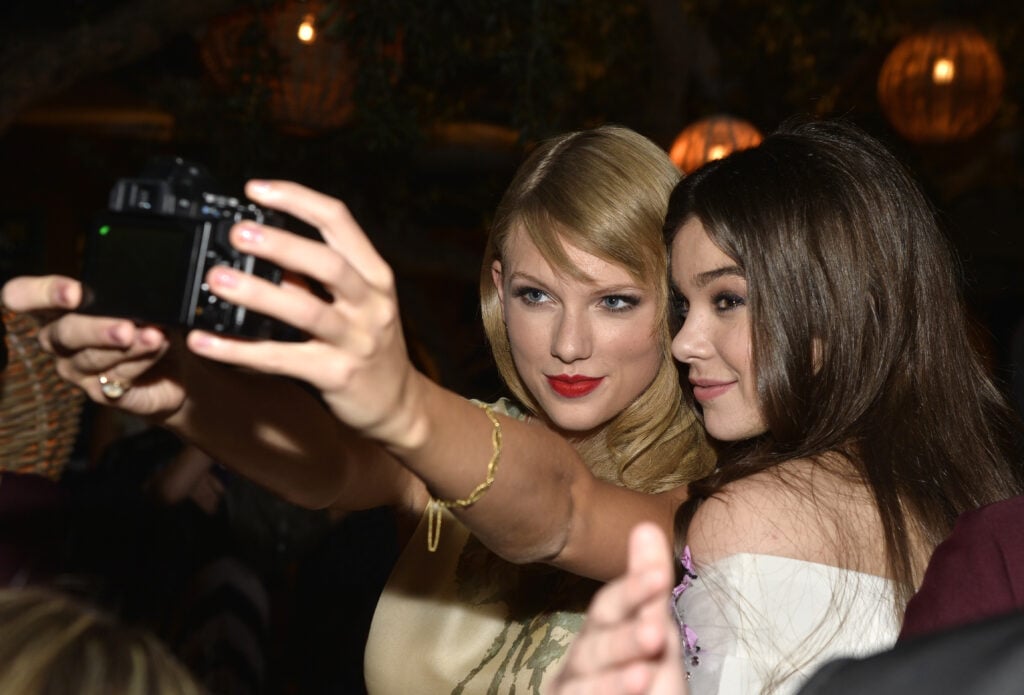 Singer Taylor Swift and actress Hailee Steinfeld attend the premiere of Relativity Media's "Romeo And Juliet" after party at Soho House on September 24, 2013 in Hollywood, California.  