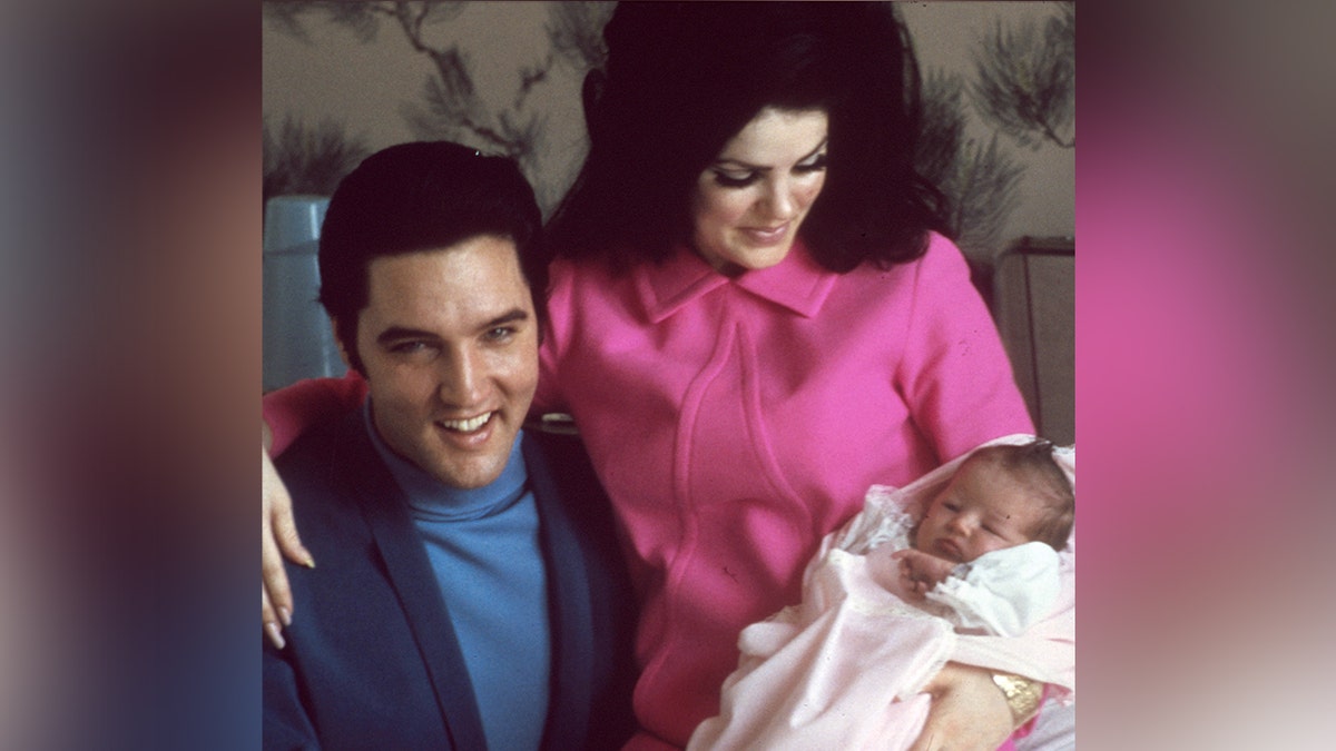 Elvis and Priscilla Presley with their newborn daughter Lisa Marie