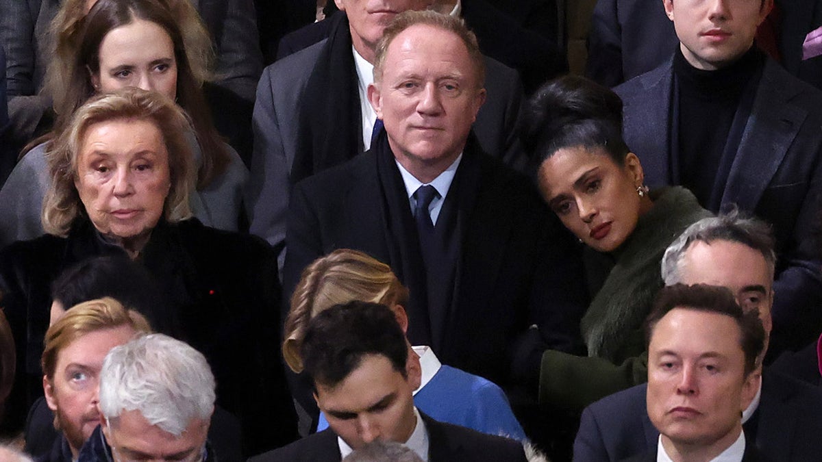 Salma Hayek rests her head on husband's shoulder at Notre-Dame Cathedral