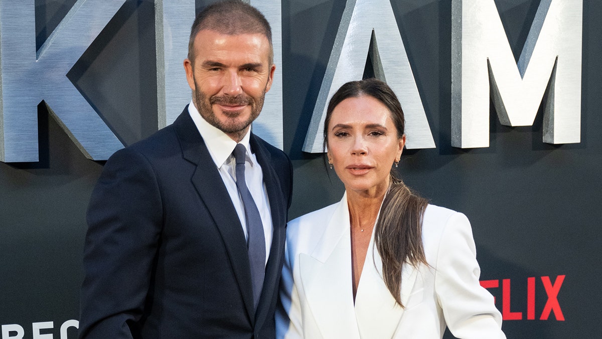 David and Victoria Beckham posing at the premiere of 'Beckham.'