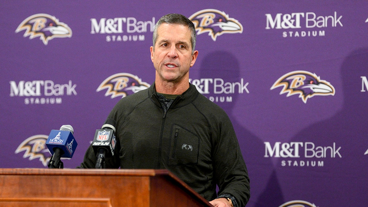 John Harbaugh talks to reporters