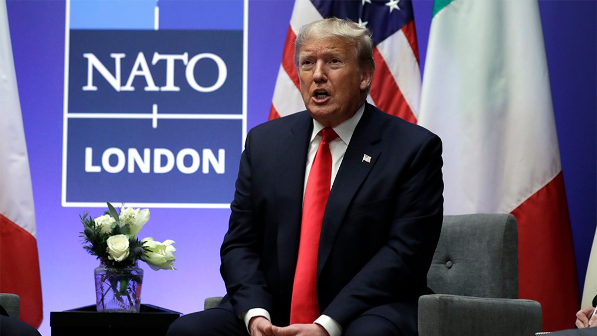 President Donald Trump speaks as he meets with Italian Prime Minister Giuseppe Conte during the NATO summit at The Grove, Wednesday, Dec. 4, 2019, in Watford, England.