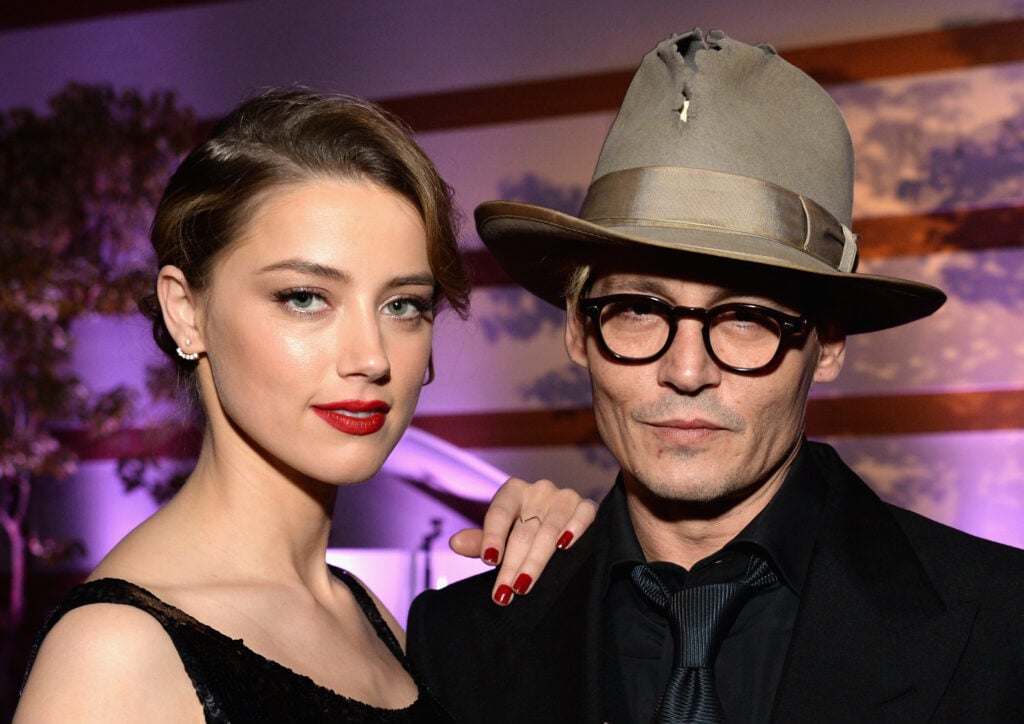 Actors Amber Heard and Johnny Depp attend The Art of Elysium's 7th Annual HEAVEN Gala presented by Mercedes-Benz at Skirball Cultural Center on January 11, 2014 in Los Angeles, California.