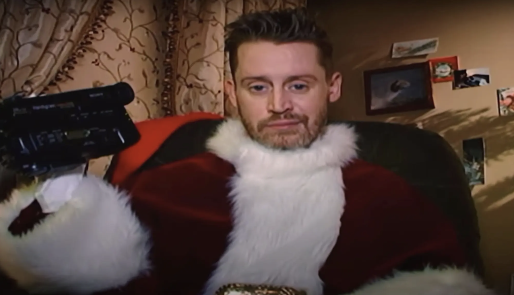 Macaulay Culkin dresses as Santa in Kim Kardashian's new music video.