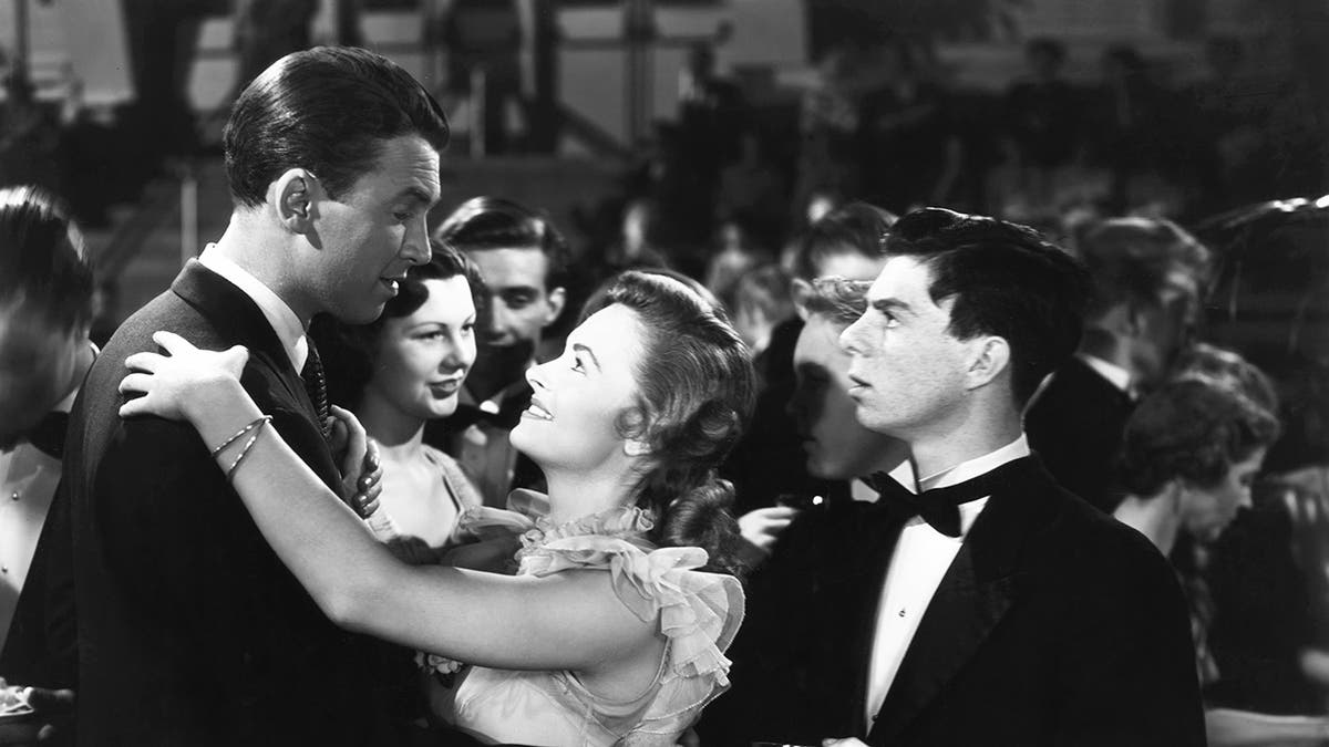 Carl Switzer looking at James Stewart dancing with Donna Reed in Its a Wonderful Life