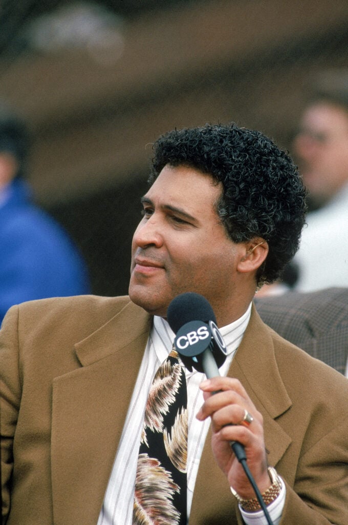 CBS Analyst Greg Gumbel talks into a microphone during the 1990 NFC Divisional Playoffs game with the Washington Redskins against the San Francisco 49ers at Candlestick Park on January 12, 1991 in San Francisco, California. 