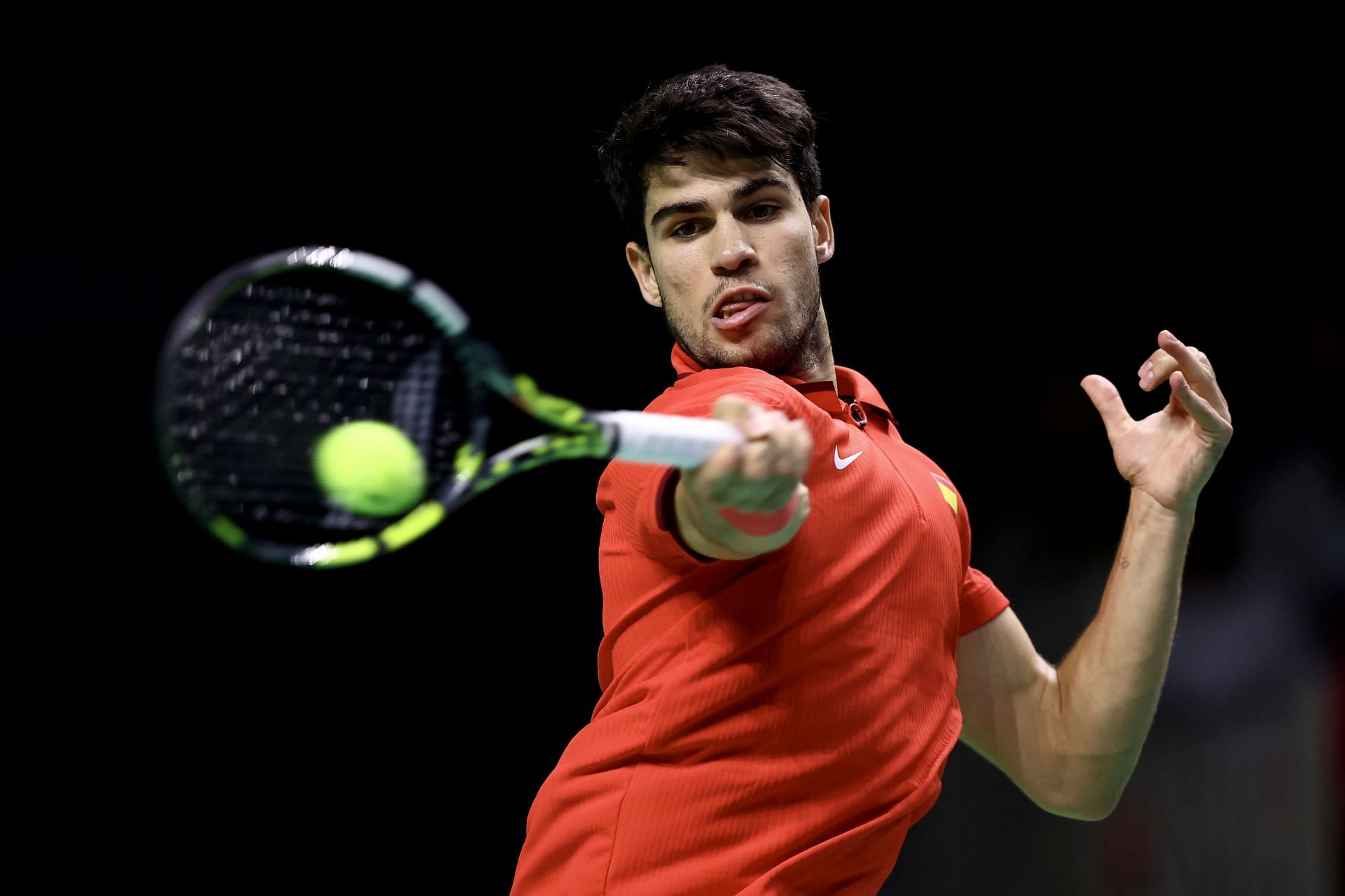 Carlos Alcaraz hits a forehand at Davis Cup Finals 2024