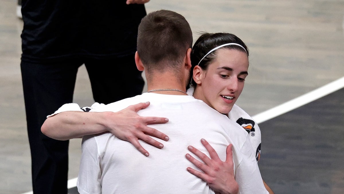 Indiana Fever guard Caitlin Clark hugs her boyfriend Connor McCaffery