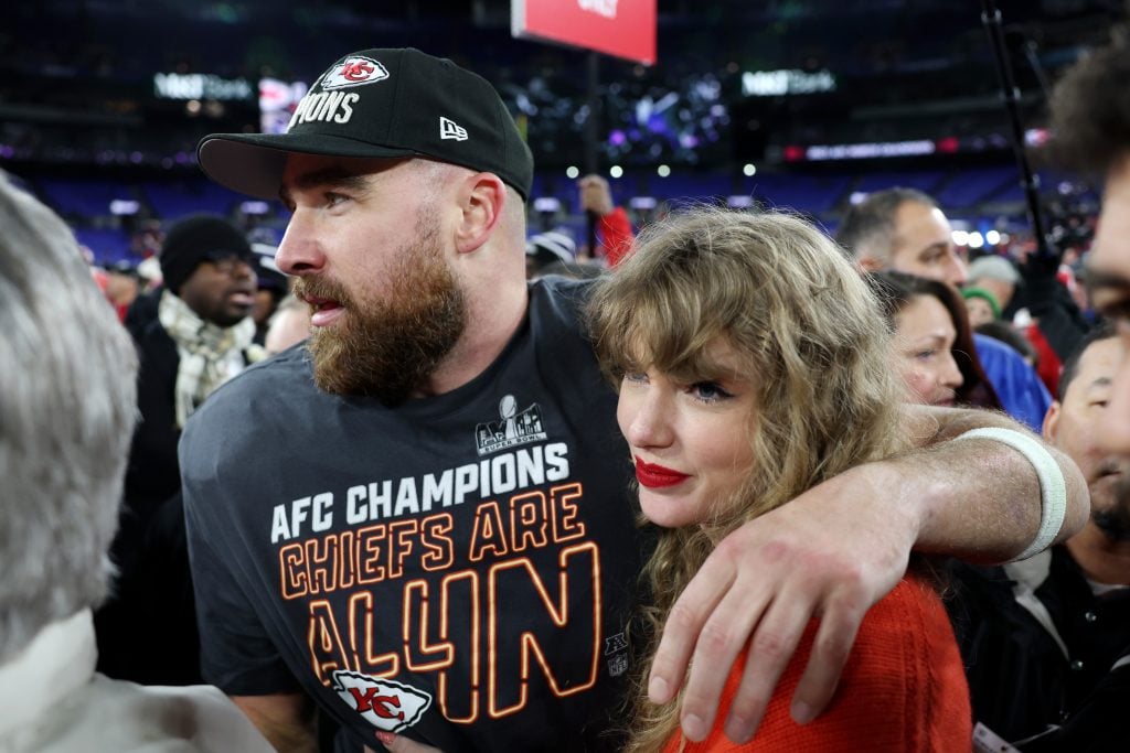 Travis Kelce and Taylor Swift on a football field on January 28, 2024.