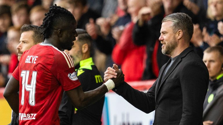 Aberdeen manager Jimmy Thelin and Pape Gueye  