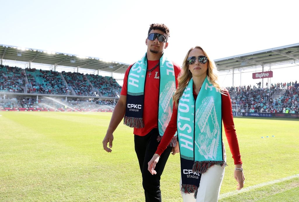 Co-owners Brittany and Patrick Mahomes walk on the field prior to the match between the Portland Thorns FC and the Kansas City Current at CPKC Stadium, the first stadium purpose-built for women's soccer, on March 16, 2024 in Kansas City, Missouri.