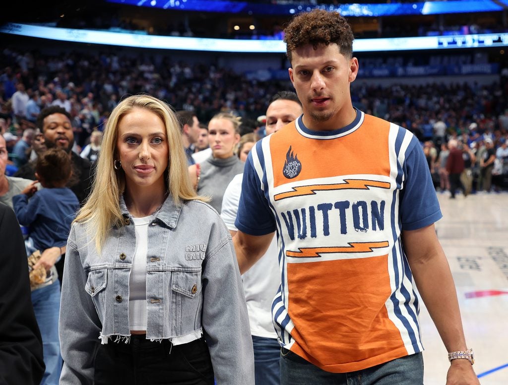 Brittany Mahomes and Patrick Mahomes walk off the court at the half during the game between the Toronto Raptors and the Dallas Mavericks at American Airlines Center on November 08, 2023 in Dallas, Texas. 