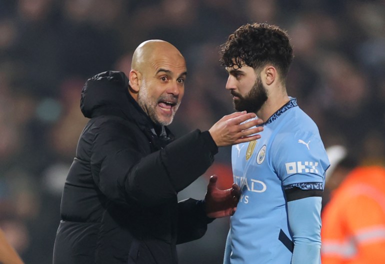 BRENTFORD, ENGLAND - JANUARY 14: Pep Guardiola, Manager of Manchester City, interacts with Josko Gvardiol of Manchester City at full-time following the team's draw in the Premier League match between Brentford FC and Manchester City FC at Gtech Community Stadium on January 14, 2025 in Brentford, England. (Photo by Alex Pantling/Getty Images)