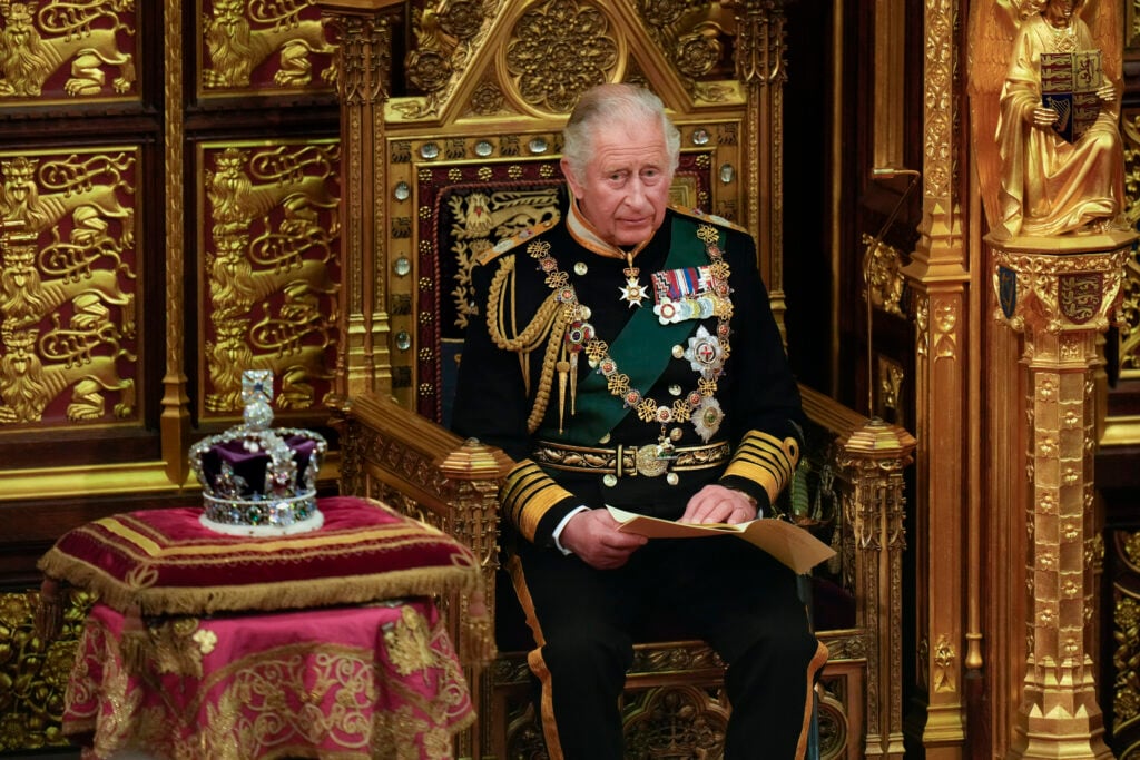 King Charles reads the Queen's speech next to her Imperial State Crown in the House of Lords Chamber, during the State Opening of Parliament in the House of Lords at the Palace of Westminster on May 10, 2022 in London, England.