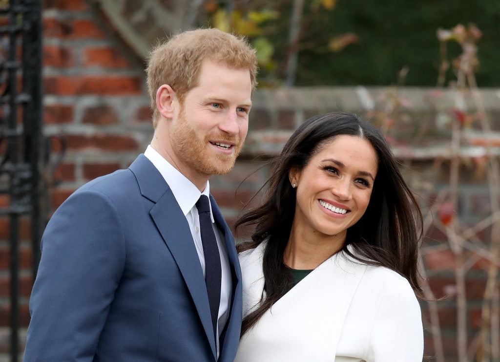 Prince Harry and actress Meghan Markle during an official photocall to announce their engagement at The Sunken Gardens at Kensington Palace on
</p>
</div></div><div class=