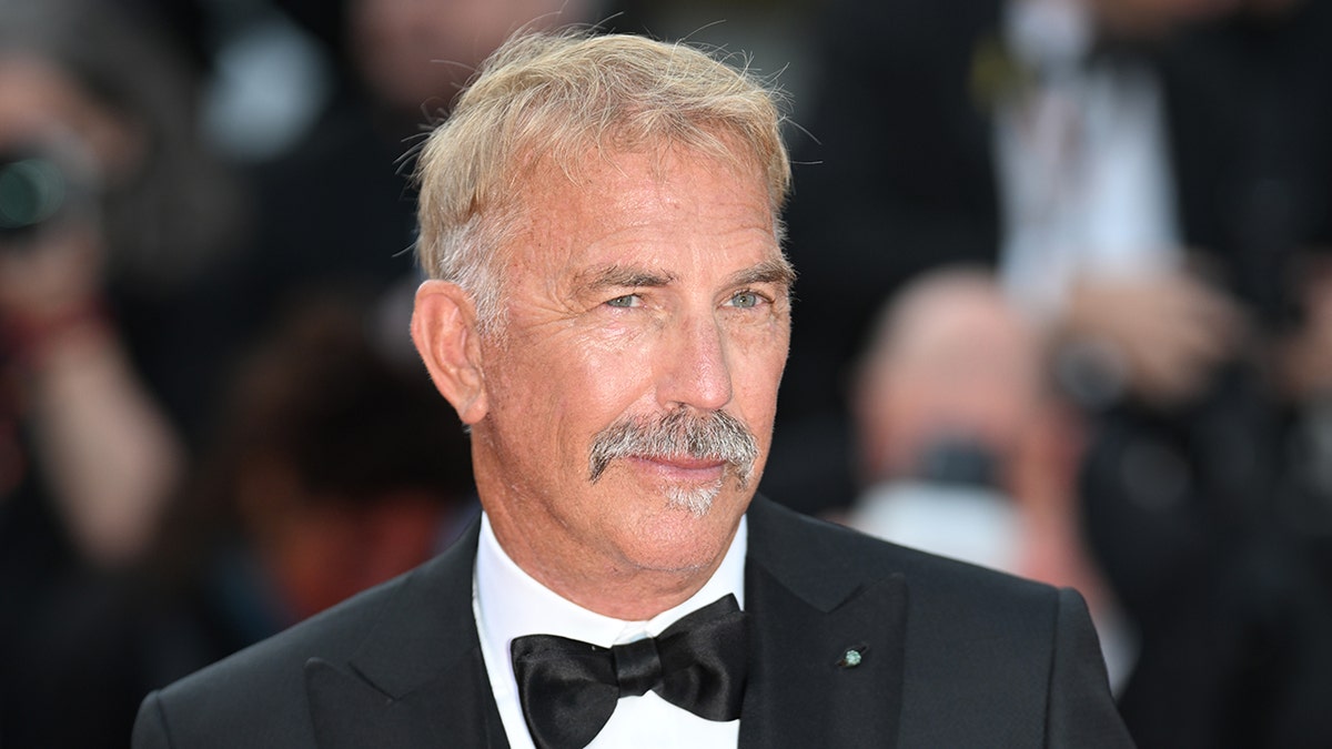 Kevin Costner sports a black bow tie and suit at the Cannes Horizon premiere.