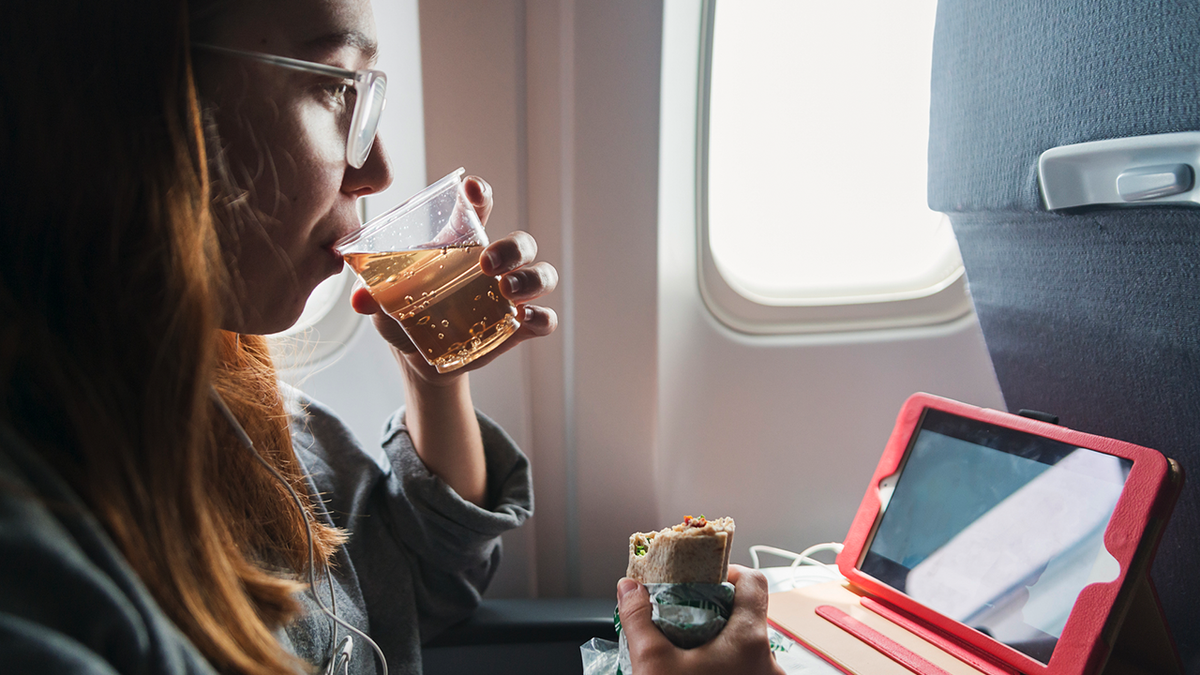 flight passenger drinking