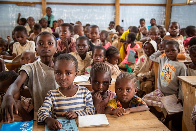 Students in a temporary learning space for displaced children in Kikumbe Village, Democratic Republic of the Congo. Credit: ECW/Makangara