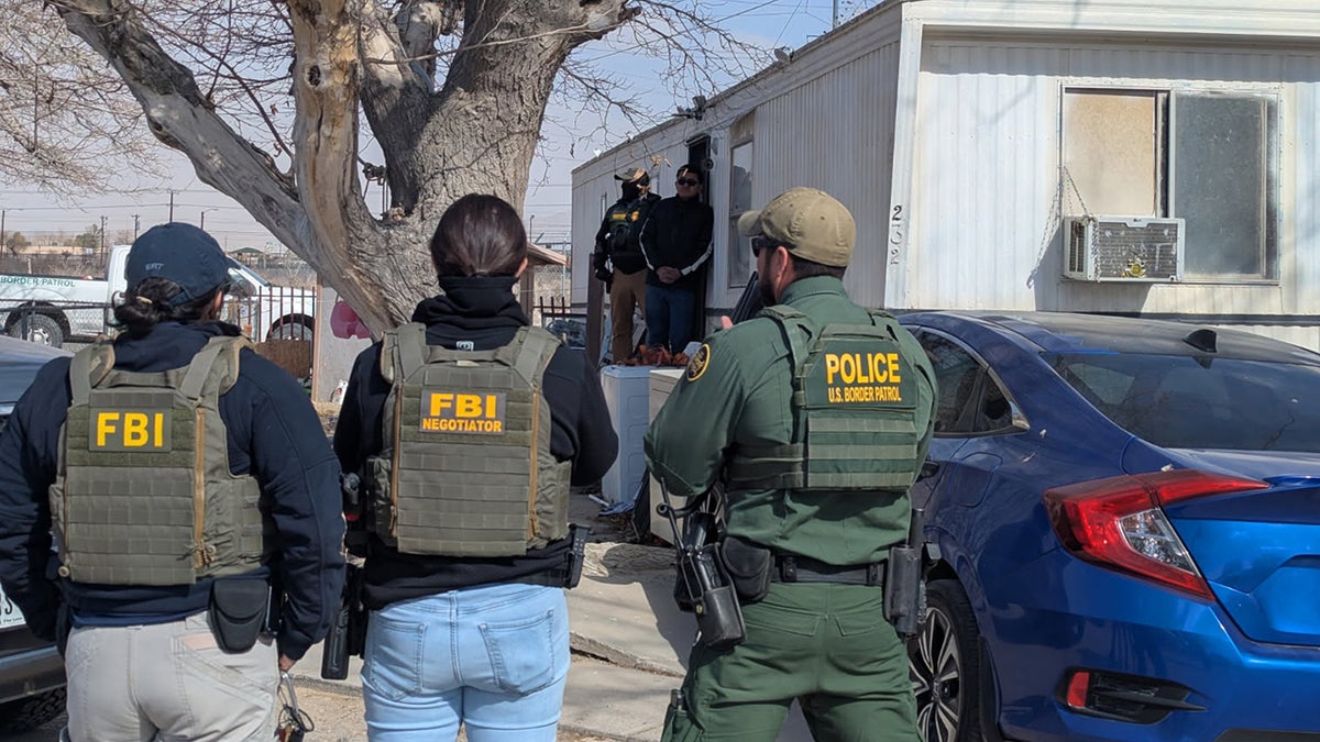 Officers from Border Patrol and the FBI conduct immigration enforcement in El Paso, Texas on Thursday, Jan. 30, 2025.