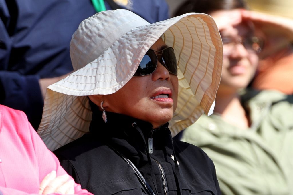 Mother of Tiger Woods, Kultida Woods, looks on from the gallery during the second round of the 2010 Masters Tournament at Augusta National Golf Club on April 9, 2010 in Augusta, Georgia. 