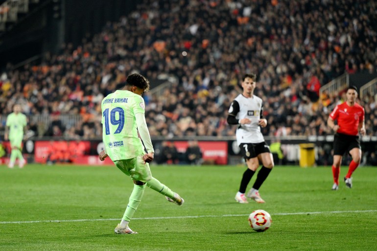 VALENCIA, SPAIN - FEBRUARY 06: Lamine Yamal of FC Barcelona scores his team's fifth goal during the Copa del Rey quarter-final match between Valencia CF and FC Barcelona at the Estadio Mestalla on February 06, 2025 in Valencia, Spain. (Photo by David Ramos/Getty Images)