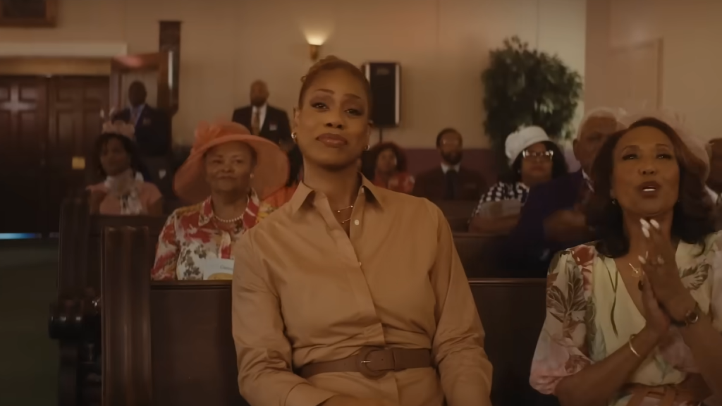 A screenshot from 'Clean Slate' showing Laverne Cox seated in a church.