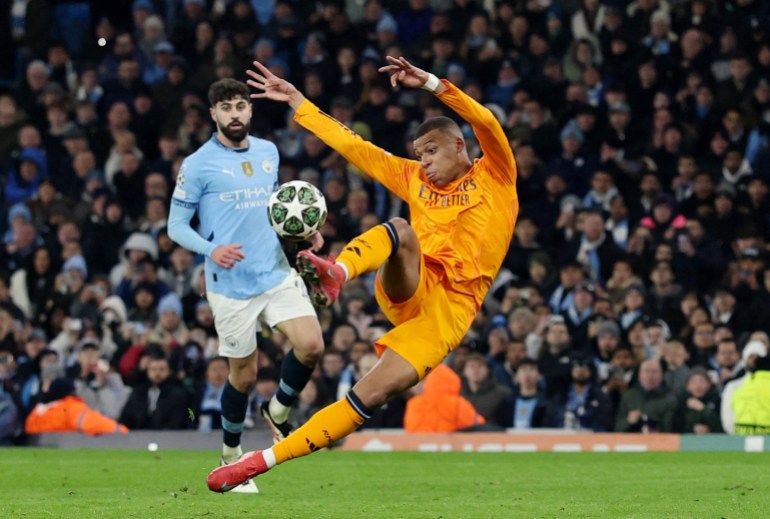 Soccer Football - Champions League - Knockout Phase Playoff - First Leg - Manchester City v Real Madrid - Etihad Stadium, Manchester, Britain - February 11, 2025 Real Madrid's Kylian Mbappe scores their first goal REUTERS/Phil Noble