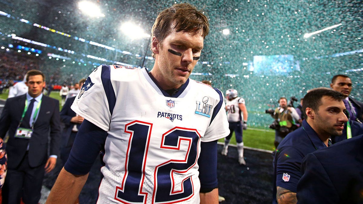 Tom Brady walks off the field