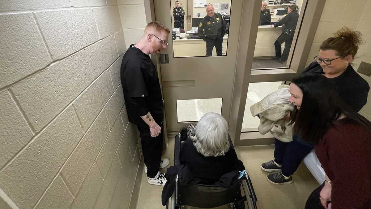 Woman in a holding cell.