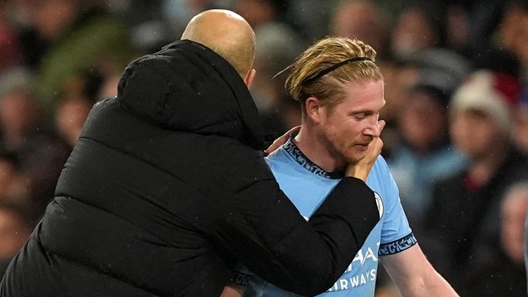 Pep Guardiola embraces Kevin De Bruyne as he leaves the pitch