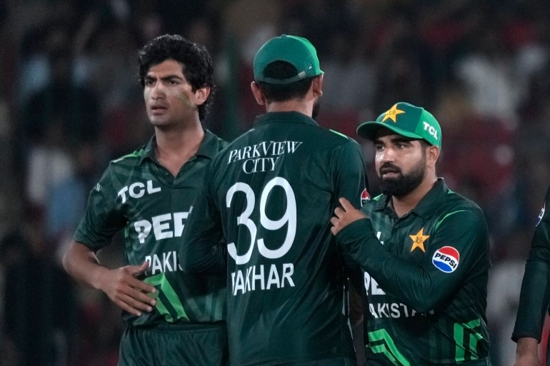 Pakistan's Naseem Shah, left, celebrates with teammates after taking the wicket of New Zealand's Devon Conway during the tri-series ODI cricket final match between Pakistan and New Zealand, in Karachi, Pakistan, Friday, Feb. 14, 2025. (AP Photo/Fareed Khan)