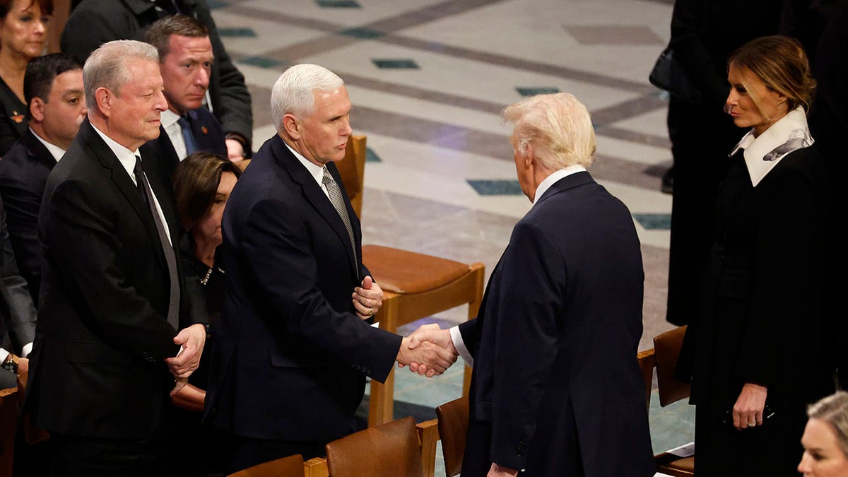 Trump and Pence shake hands at Jimmy Carter funeral