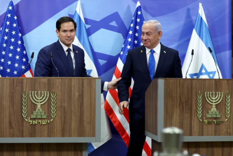 U.S. Secretary of State Marco Rubio, left, and Israeli Prime Minister Benjamin Netanyahu shake hands during a news conference at the Prime Minister's office in Jerusalem, Israel, Sunday, Feb. 16, 2025. (Evelyn Hockstein/Pool Photo via AP)