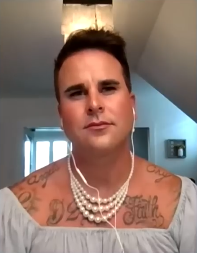 Josh Seiter wearing a pearl necklace.