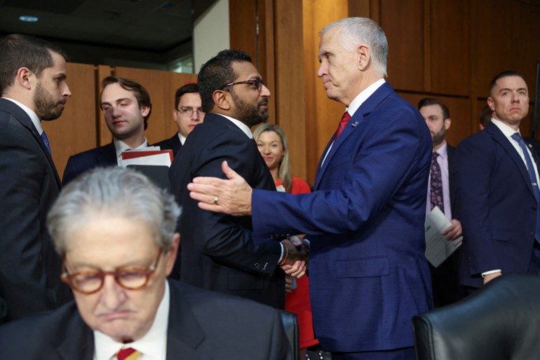 Thom Tillis shakes hands with Kash Patel