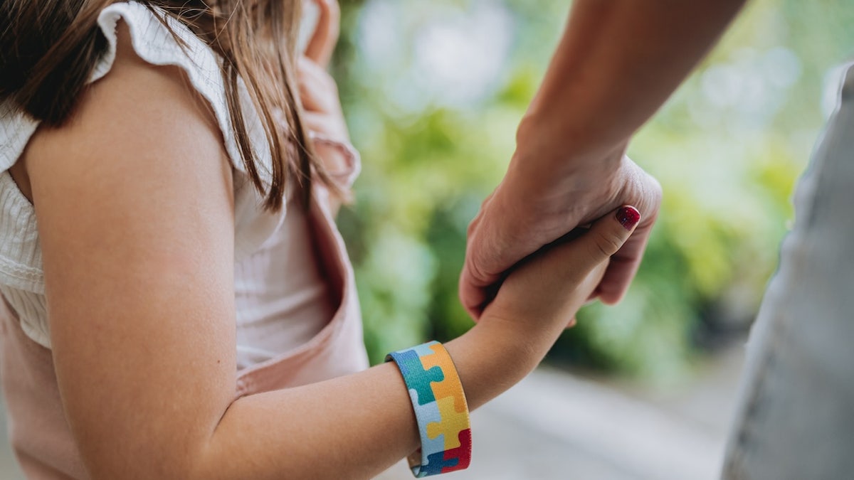 Child holding hand