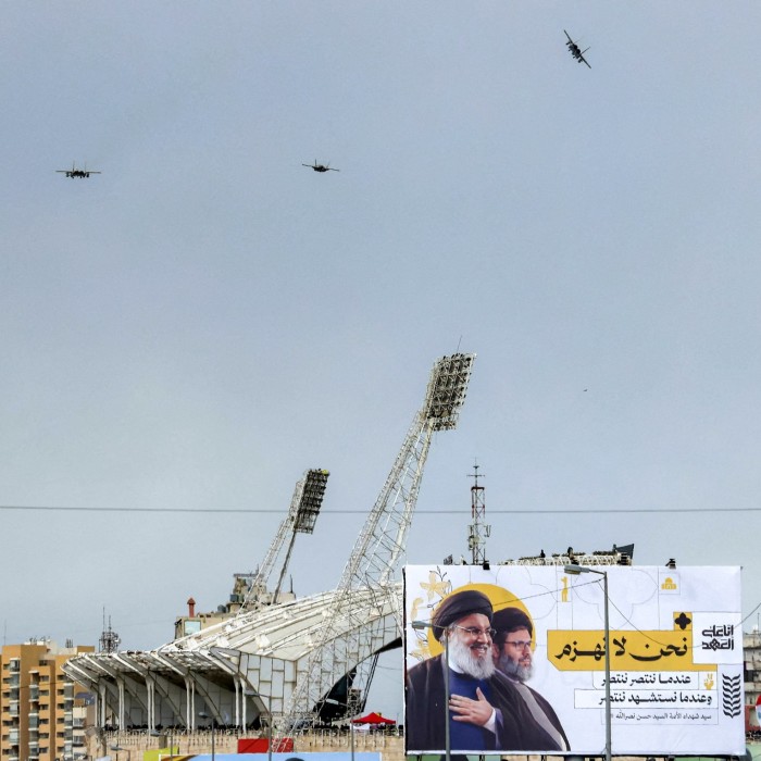 Israeli Air Force F-15 and F-35 fighter aircraft fly over Camille Chamoun Sports City Stadium