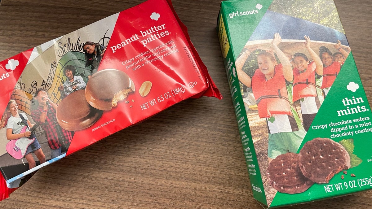 Two popular flavors of Girl Scout cookies, Peanut Butter Patties and Thin Mints, are shown on a table.