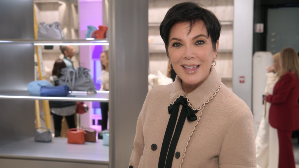 Kris Jenner smiles at an upscale store on The Kardashians.