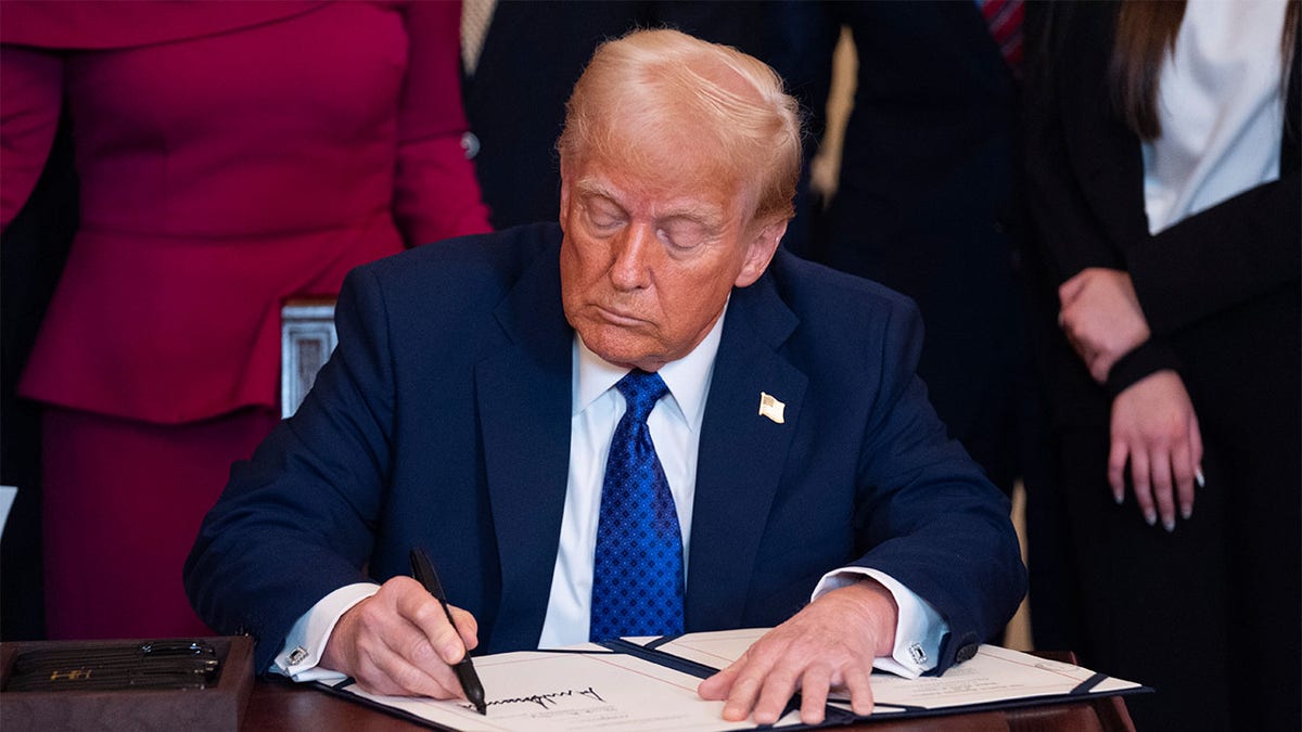 President Donald Trump signs the Laken Riley Act at the White House, Wednesday, Jan. 29, 2025. (AP Photo/Evan Vucci)